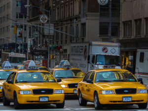4 taxis stopped at an intersection