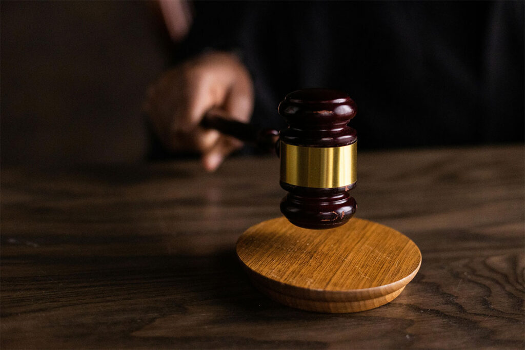 Close-up of a judge's gavel in motion.